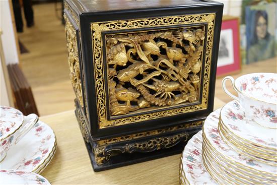 A late 19th/early 20th century Chinese giltwood and black lacquer incense stand